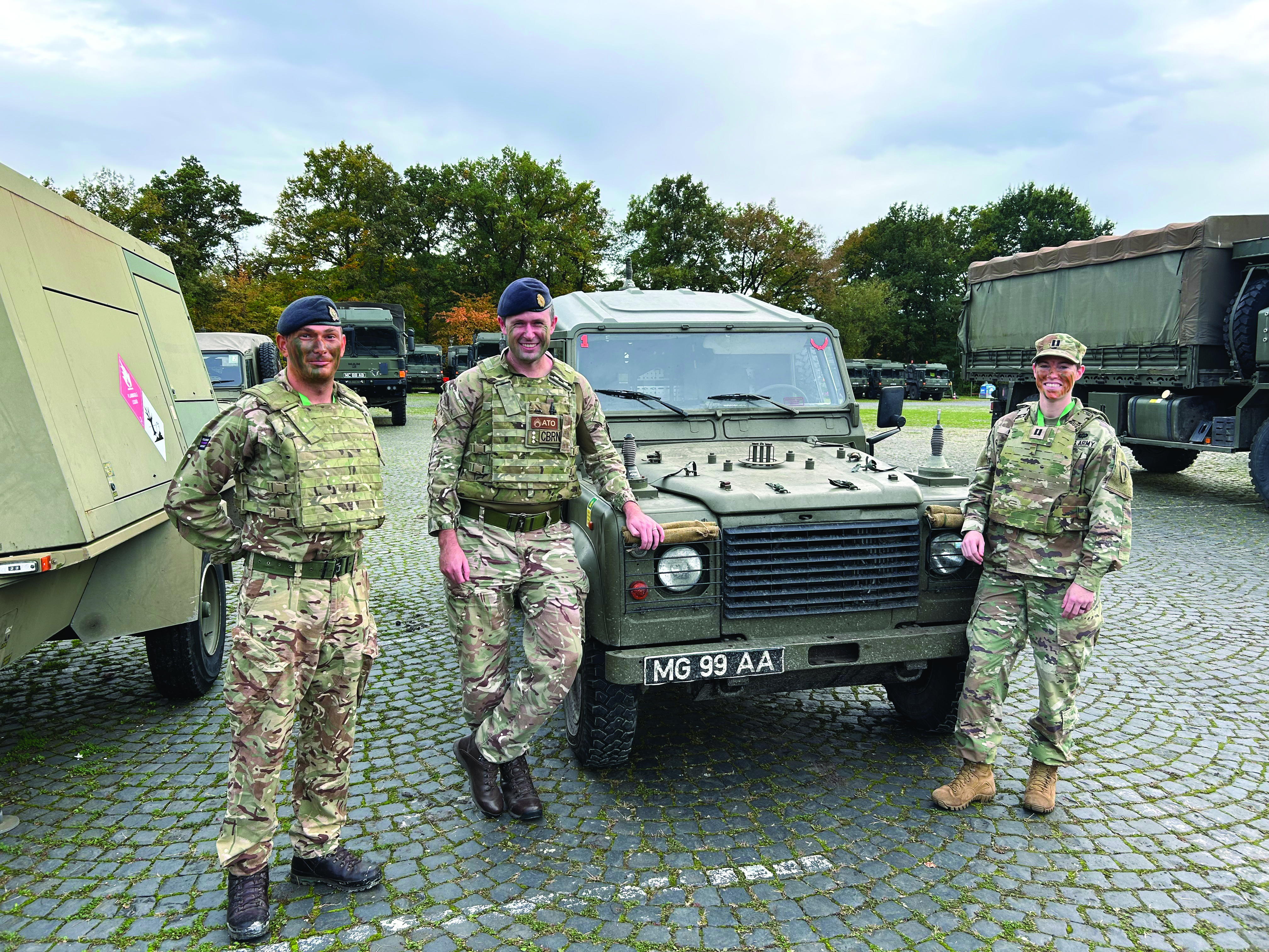CPT Megan Holt (right), U.S. Army Europe and Africa national security law attorney, while on an observer
      mission to the United Kingdom for a multinational exercise. (Photo courtesy of author)